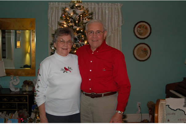 My grandparents in front of their tree at their house in South Boston.